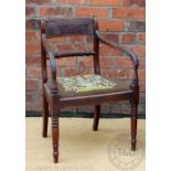 A set of four Regency mahogany dining chairs, with rope twist backs and drop in tapestry seats,