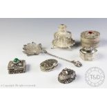 A collection of assorted Eastern white metal items to include five boxes and covers,