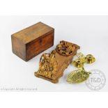 A 19th century oak tea caddy, 23cm wide, with a Black Forest type carved soft wood book slide,