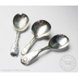 Three silver caddy spoons comprising; Thomas Wallis II, London 1803, John & Henry Lias,