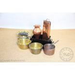 A collection of 19th century and later copper, brass and other cooking vessels and warmers,