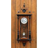 A walnut and ebonised Vienna regulator wall clock,