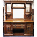 A large late Victorian carved walnut mirror back side board of country house proportions,