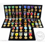 A collection of fifty American military medals and merit awards, to include a Purple Heart,