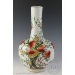 A Chinese porcelain nine peaches vase,