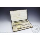 A French silver handled five piece carving set retailed by Manche Argent Paris,