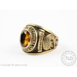 An unusual American gents signet ring, set with a central citrine,