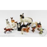 A collection of Beswick animals to include a Siamese cat, three fox hounds, fox, corgi,