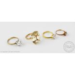 Four assorted dress rings, to include; a citrine set example,