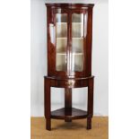 A 19th century French inlaid walnut bow front display cabinet, with two doors enclosing shelves,