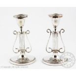 A pair of old Sheffield plate candlesticks,