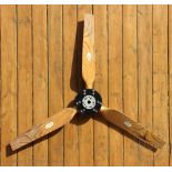 An American propeller, with three laminated wood blades with labels for 'Precision Propellers Inc',