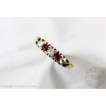 A George V ruby and diamond five stone ring, Birmingham 1911, set in 18ct yellow gold,