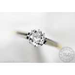 A diamond solitaire ring,