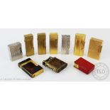 A collection of ten vintage cigarette lighters, comprising a Dunhill plated 'slide wick' lighter,