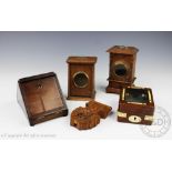 Five assorted 19th century and later pocket watch stands comprising;