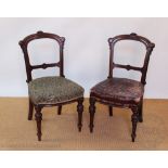 A set of six late Victorian carved walnut dining chairs, with upholstered seats,