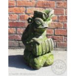 A Balinese type reconstituted stone temple model, of a frog playing an xylophone,