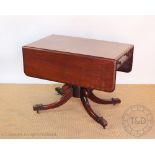 A Victorian mahogany Pembroke table, with turned column, on hipped splayed legs,