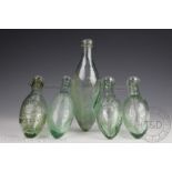 A collection of five glass Hamilton bottles,