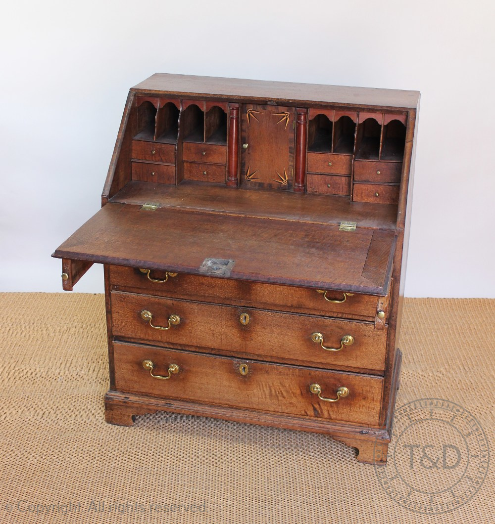 A George III oak bureau, with fall enclosing a fitted interior, above four graduated long drawers, - Image 3 of 3