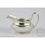 A George III silver cream jug, John Emes, London 1803,