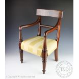 A Regency mahogany apprentice chair / dolls chair, with curved back and later upholstered seat,