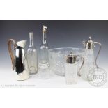 A selection of glass ware to include two silver plated claret jugs, each with mask cast spouts,