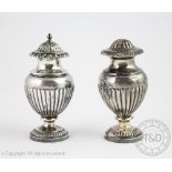 A near pair of baluster pepperettes, Barnard and Sons, London 1923, each of stop fluted form,