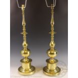A pair of Dutch style brass table lamps, with pleated cream shades,