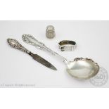 A selection of small silver, comprising; an Edwardian silver thimble Charles Horner Chester 1903,