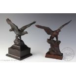Two Black Forest type carved and stained soft wood models of eagles, each signed 'A J Miller',
