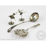 An Art Nouveau sterling silver sifter spoon,with flower head pierced bowl, handled initialled 'C',