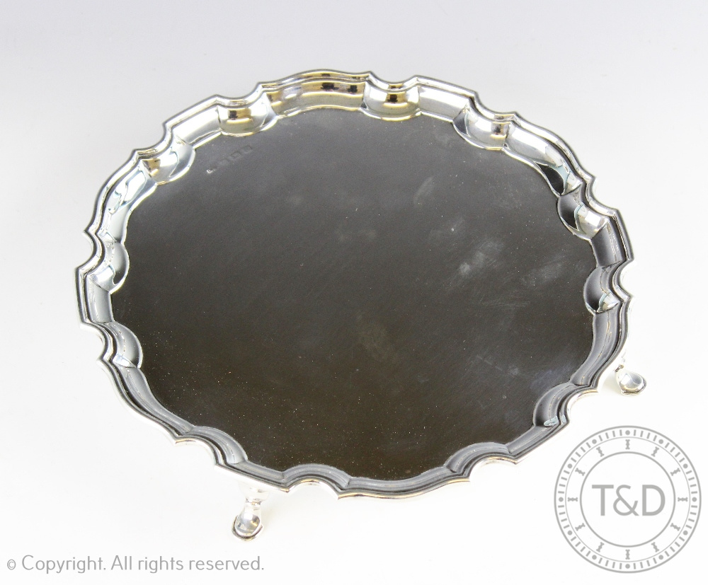 A George V silver salver, Birmingham 1928, with pie crust edge, marks rubbed, 17.3ozt, 25.