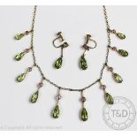An Edwardian peridot and pink tourmaline set fringe necklace and matching earrings,