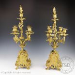 A pair of late 19th century Louis XV style gilt brass five light candelabra, 60.