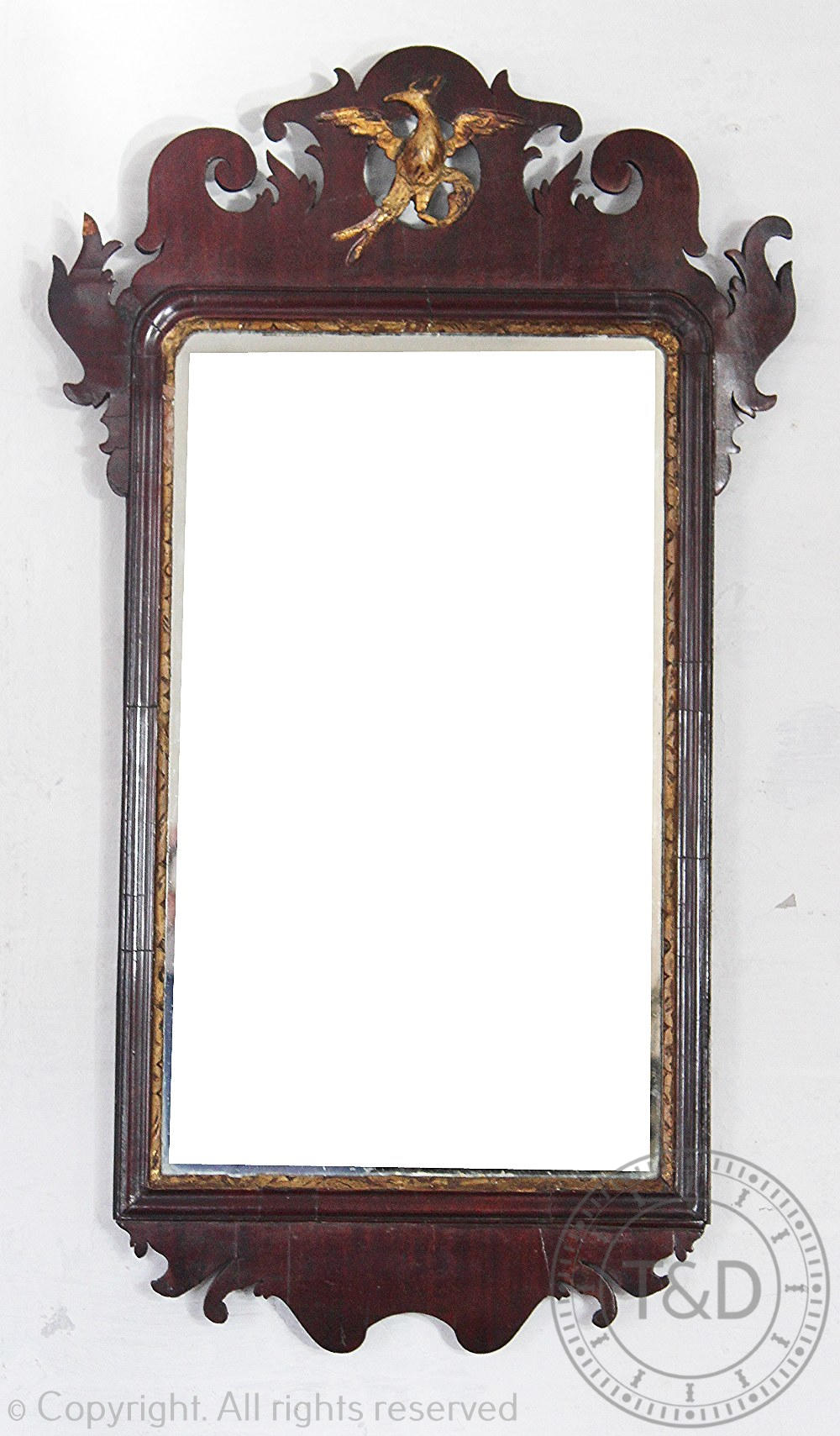 A George III style walnut and gilt wood and gesso fret frame wall mirror,