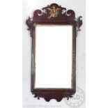 A George III style walnut and gilt wood and gesso fret frame wall mirror,