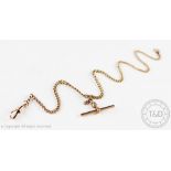 A 9ct gold watch Albert, the uniform slender curb link chain suspending a T bar, 16.