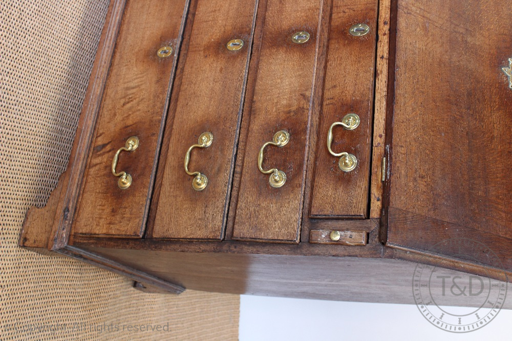 A George III oak bureau, with fall enclosing a fitted interior, above four graduated long drawers, - Image 2 of 3