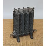 An Edwardian cast iron radiator, with floral detailing,