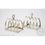 A pair of silver toast racks, Emile Viner, Sheffield 1932, each of typical arched,