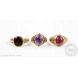 A cabochon garnet set 9ct gold signet ring, a cabochon smethyst set gold ring,