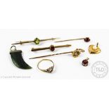 A selection of jewellery, to include; a diamond set tie pin surmounted by an 'A',