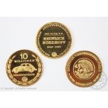 Three Volkswagen gold commemorative coins / medallions, one for '10 millionen Volkswagen' 1965,