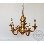 An ormolou (gilt on brass) five branch light fitting with another brass five branch light fitting