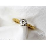 A diamond solitaire ring, the old brilliant cut diamond, collet set in white metal,