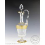 An early / mid 20th century continental cut and gilt glass claret jug and stopper,