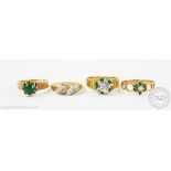 A collection of four rings, to include; an emerald and diamond ring in 18ct yellow gold weight 6.