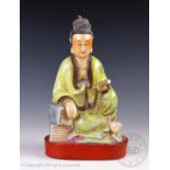 A Chinese porcelain figure of a Scholar, 20th century,